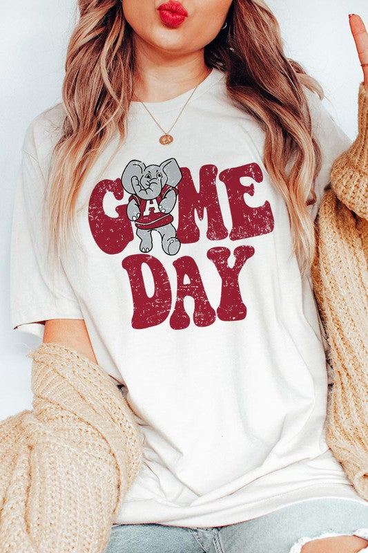 Game Day graphic short-sleeve T-shirt with printed lettering, shown worn by a model