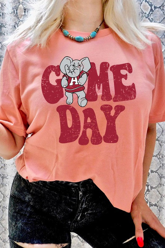 Game Day graphic short-sleeve T-shirt with printed lettering, shown worn by a model