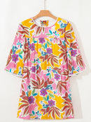 Front view of the floral mini dress on a hanger