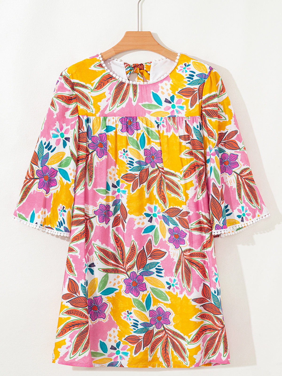 Front view of the floral mini dress on a hanger