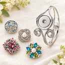 Sandy Snap Elegant Swirl Interchangeable Bracelet for 18mm Snap Buttons plain base beside four separate decorative snaps; styling choices