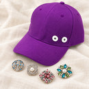 Multicolor Sandy Snap Interchangeable Charm Baseball Caps plain base beside four separate decorative snaps; styling choices