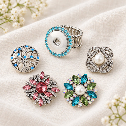Colored Crystals Elastic Stretchable Snap Ring Interchangeable Charm Ring plain base beside four separate decorative snaps; styling choices