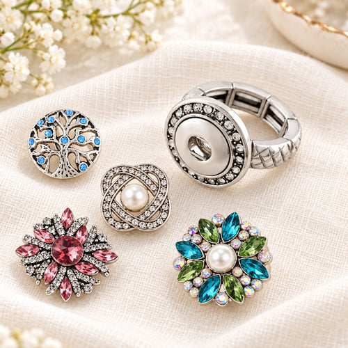Sandy Snap Interchangeable Charm Ring plain base beside four separate decorative snaps; styling choices