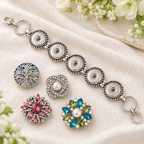Five Snap Sandy Snap Interchangeable Charm Bracelet plain base beside four separate decorative snaps; styling choices