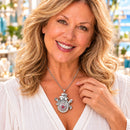 Woman wearing a silver-tone snowman pendant necklace