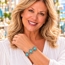 Woman wearing a bracelet with turquoise coastal snap charms