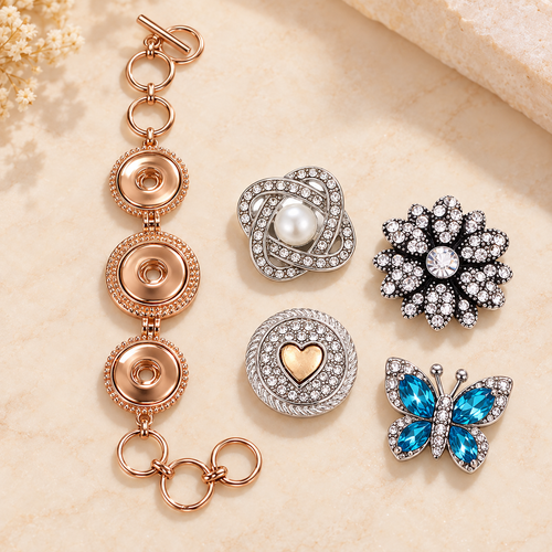 Plain rose gold three-snap toggle bracelet with empty settings beside pearl, clear crystal, gold heart and blue butterfly snaps