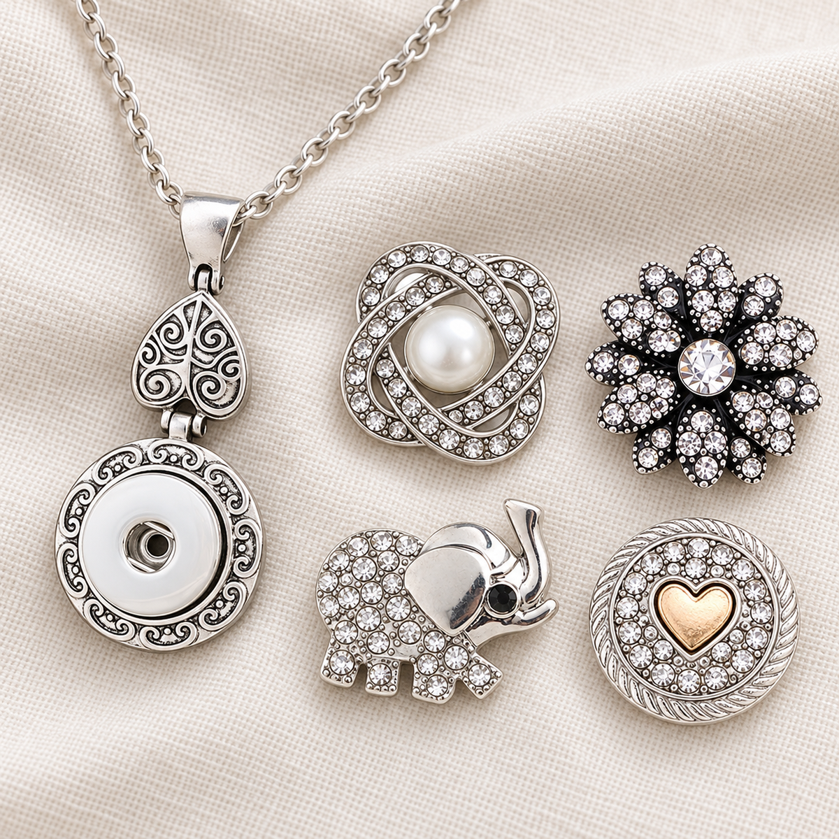 Empty silver circle and vintage heart snap necklace beside pearl, crystal flower, elephant and gold-heart snap choices