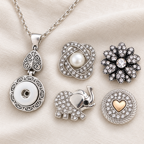 Empty silver circle and vintage heart snap necklace beside pearl, crystal flower, elephant and gold-heart snap choices