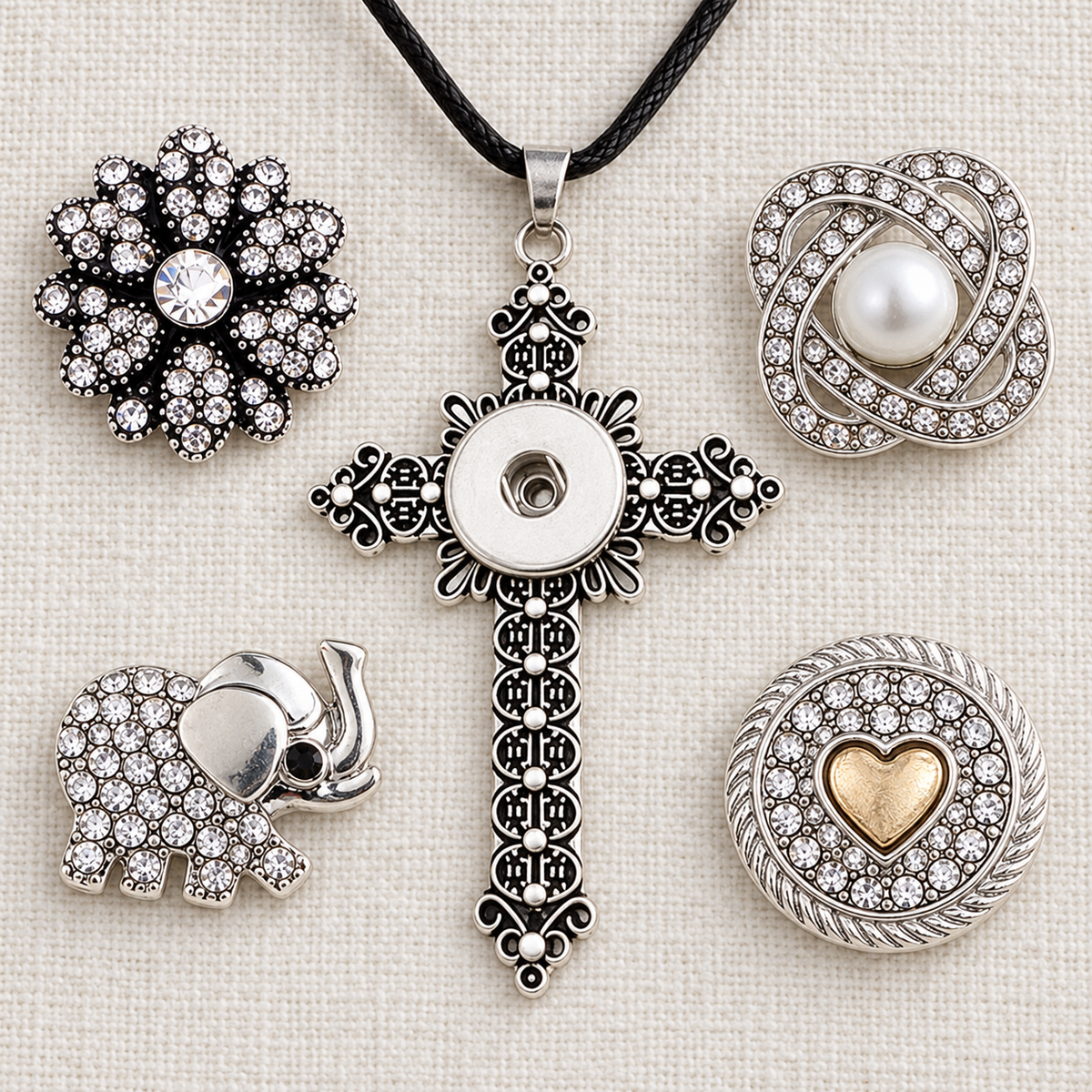 Empty filigree cross necklace with crystal flower, pearl, elephant and gold heart snap choices