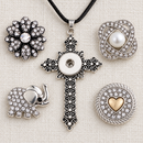 Empty filigree cross necklace with crystal flower, pearl, elephant and gold heart snap choices