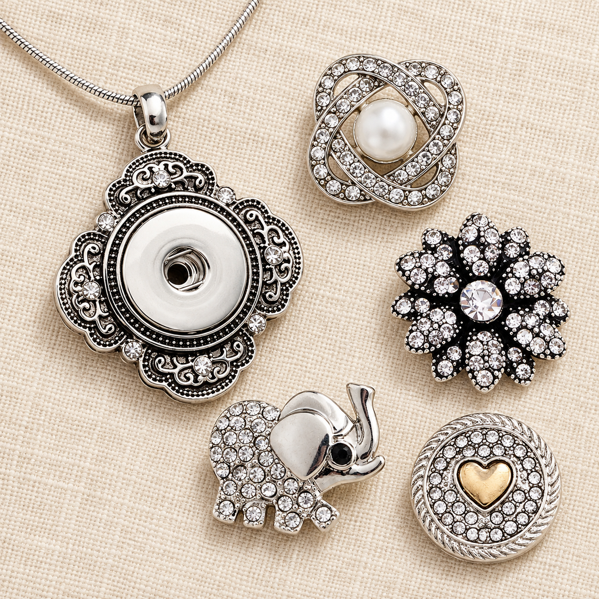 Empty ornate silver pendant necklace with pearl, crystal flower, elephant and gold heart snap choices