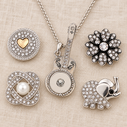 Empty silver guitar necklace beside four snap choices