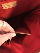 Interior slip pocket in the red-lined Janko Ruth Wine handbag