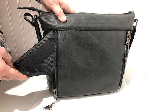 Open concealed compartment on the black Janko Ruth handbag