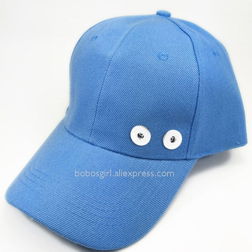 Interchangeable customizable cap that has two charm holders in front where you can snap in and snap out different charms . You can basically turn one cap into 50 with just the snap of a charm. See our Sandy Snap Charms to choose the look for you!